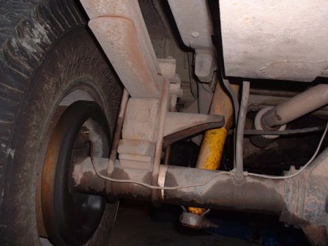 1983 Ford Bronco - Underside view of the rear axle and leaf spring suspension system on a 1983 Ford Bronco.