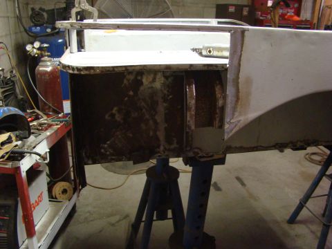 1948 Jeep Wrangler - This photo shows a section of a vehicle's body undergoing repair, with visible rust and welding work.