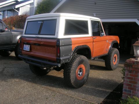 1972 Ford Bronco - This modified Ford Bronco features a two-tone paint scheme and off-road tires.