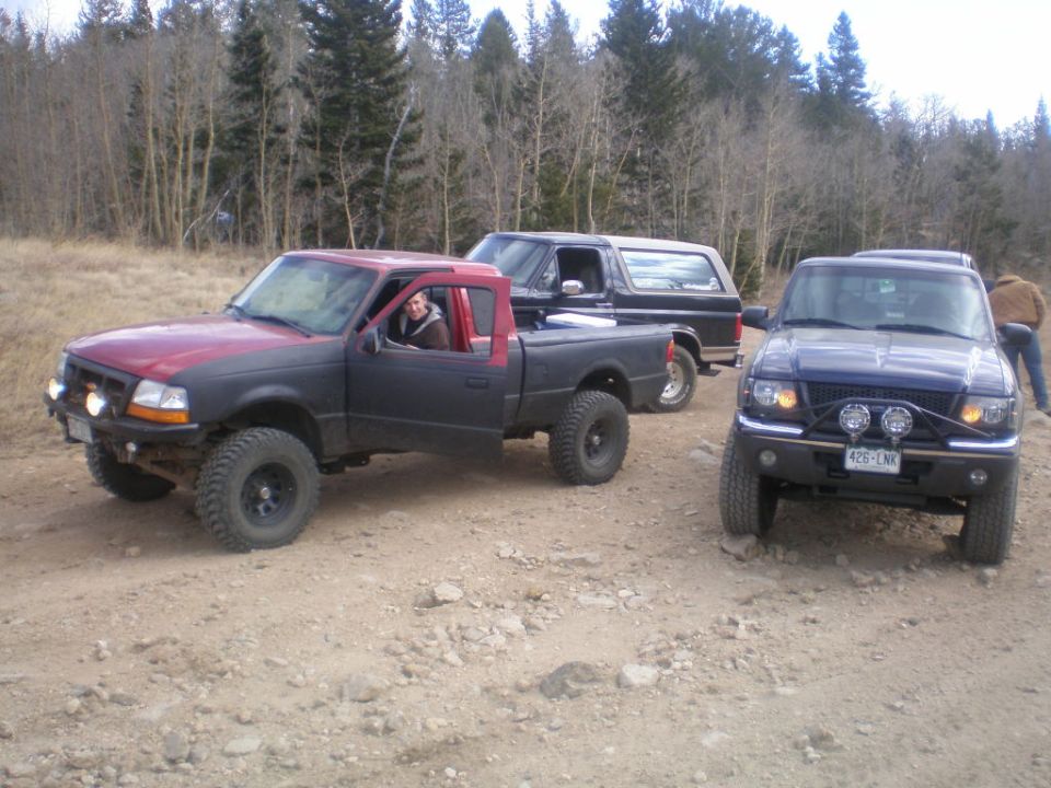 Black Ford Bronco with a lifted suspension and off-road tires