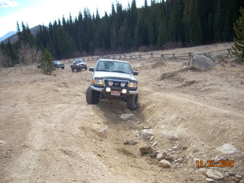 2004 Ford Ranger - Ford Ranger navigates an off-road trail with other vehicles present.