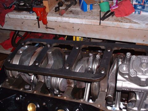 1983 Ford Bronco - Close-up view of an engine's crankshaft and connecting rods, likely during assembly or repair.