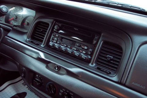 2001 Ford Crown Victoria - Interior view of a 2001 Ford Crown Victoria dashboard, highlighting the central console and driver's instruments.