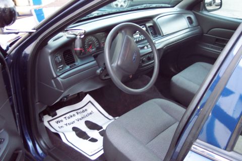 2001 Ford Crown Victoria - Interior view of a 2001 Ford Crown Victoria, the dashboard and front seats.
