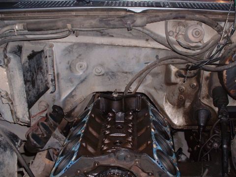 1983 Ford Bronco - Engine bay view showing the V8 engine block and cylinder heads removed, revealing internal components.