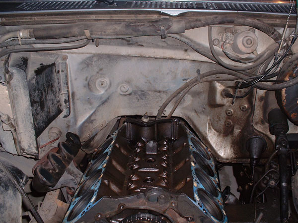 Engine bay with V8 engine block and cylinder heads removed