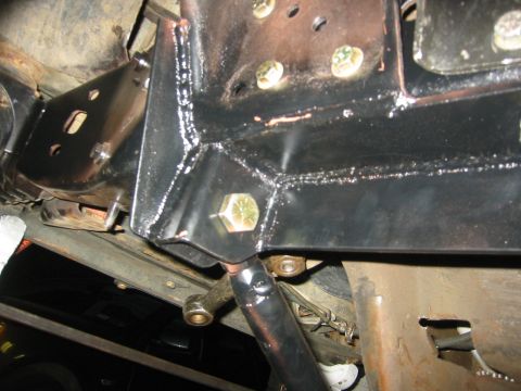 1995 Ford Bronco - Underside view of vehicle chassis with visible suspension and frame components.