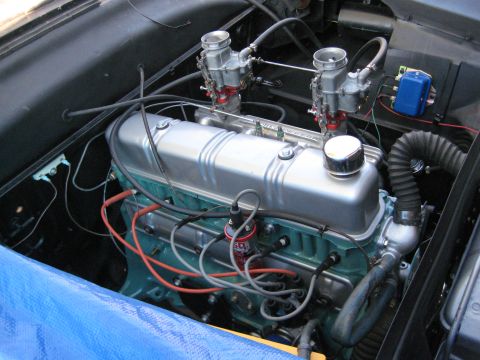 1953 Ford Mainline - Engine bay details with twin carburetors and a silver valve cover.