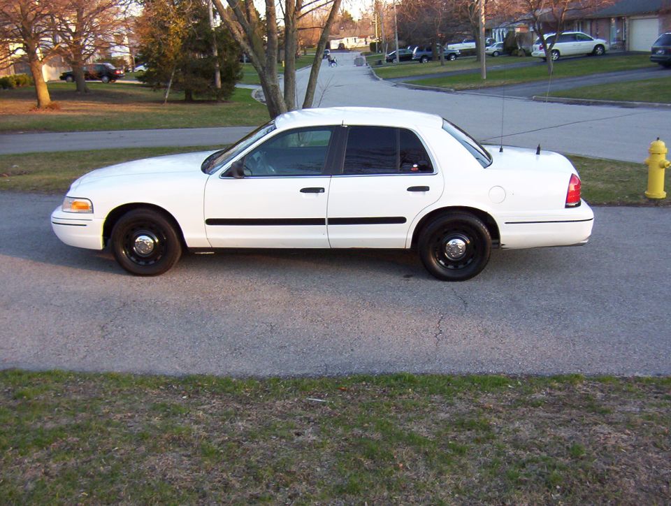 White 2003 Ford Crown Victoria sedan, side view