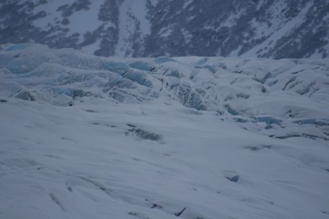 1990 Chevrolet Suburban - The vast expanse of Knik Glacier under a winter sky, showing its icy terrain and mountainous backdrop.