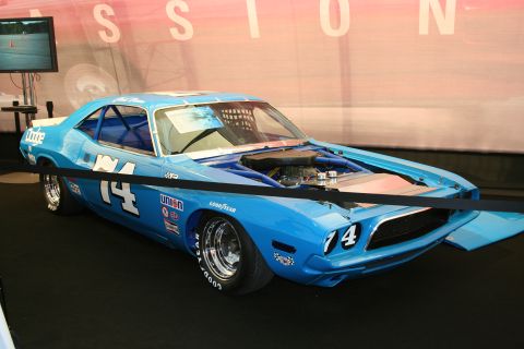 Blue race car with number 14 on the side and hood, open hood showing engine, Goodyear tires