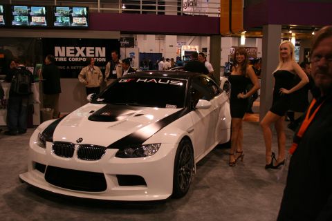 White and black BMW M3 coupe with custom body kit and racing stripes