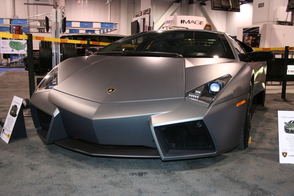 Matte gray Lamborghini Reventon front view, angled left, with visible headlights and grille