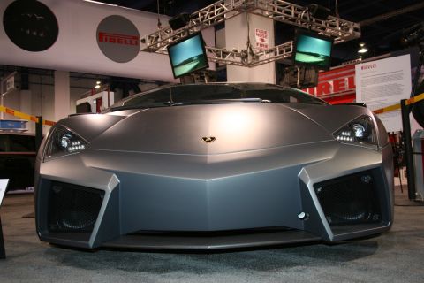 Matte gray supercar front view with angular design and LED headlights