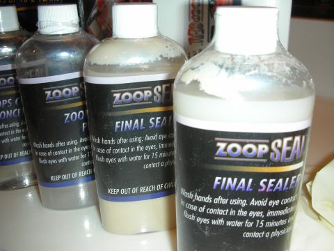 1998 Ford Crown Victoria - Several bottles of Zoop Seal products, including Final Sealer, are arranged on a white surface.