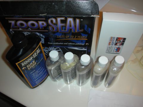 1998 Ford Crown Victoria - Collection of Zoop Seal car care products, including tire and trim shine, and other detailing liquids.