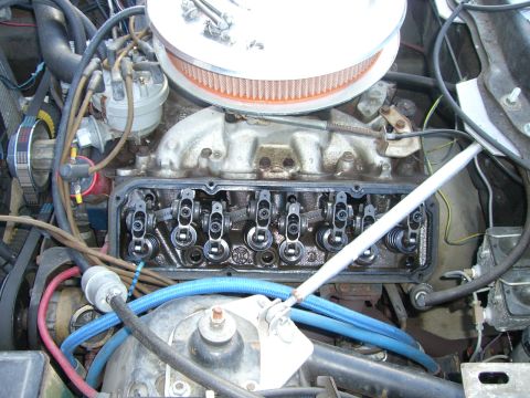 1971 Ford Mustang - Close-up view of an engine's internal components, including rocker arms and intake manifold, with valve covers removed.
