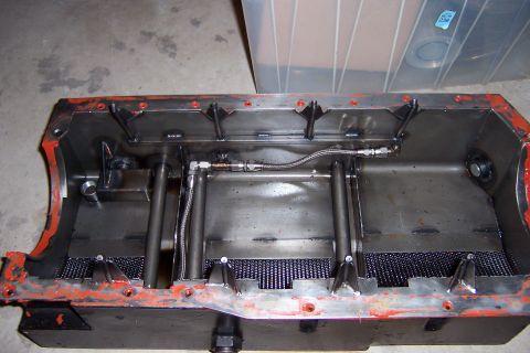 1971 Ford Mustang - This is a custom oil pan with internal baffling and braided lines, likely for a performance engine build.