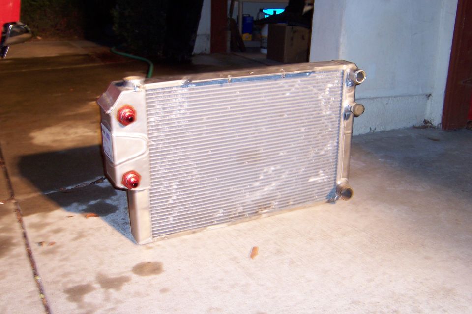 Radiator with red caps and aluminum tanks