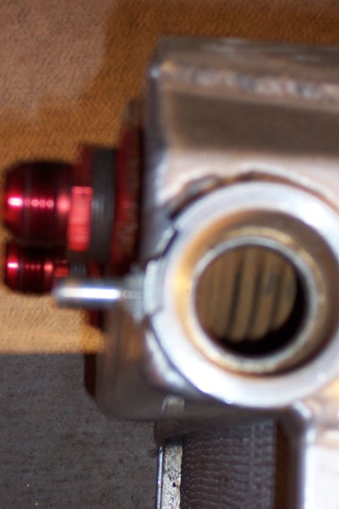1971 Ford Mustang - Radiator part with red fittings, likely for a custom build or repair.