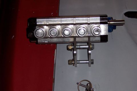 1971 Ford Mustang - A close-up view of a multi-port valve assembly five circular buttons and a metal mounting bracket.