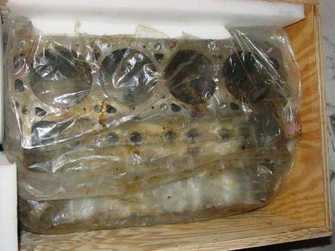 1971 Ford Mustang - Engine block, wrapped in plastic and secured in a wooden crate, is shown in this image.