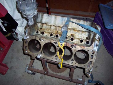 1971 Ford Mustang - Engine block with distributor is mounted on a stand, ready for work.