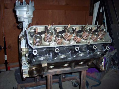 1971 Ford Mustang - Engine block and distributor assembly shown in a workshop setting.