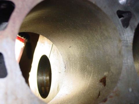 1971 Ford Mustang - Interior view of an engine cylinder bore showing honing marks and some debris.