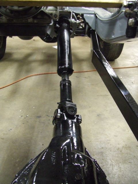 1967 Ford Bronco - Close-up of vehicle drivetrain components, including driveshaft and differential.