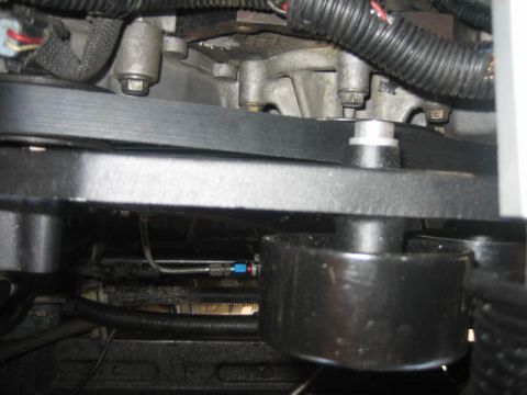 1996 Ford Thunderbird - Close-up view of engine belts and pulleys, with a watermark indicating the source as Supermotors.net.