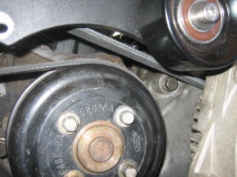 1996 Ford Thunderbird - Engine belt tensioner and pulley system detail. Part number 528-AA is visible on the pulley.