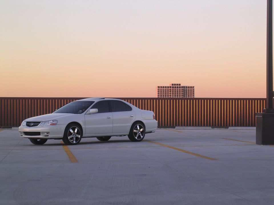 White 2003 Acura TL sedan parked on a rooftop at sunset, 3/4 front view