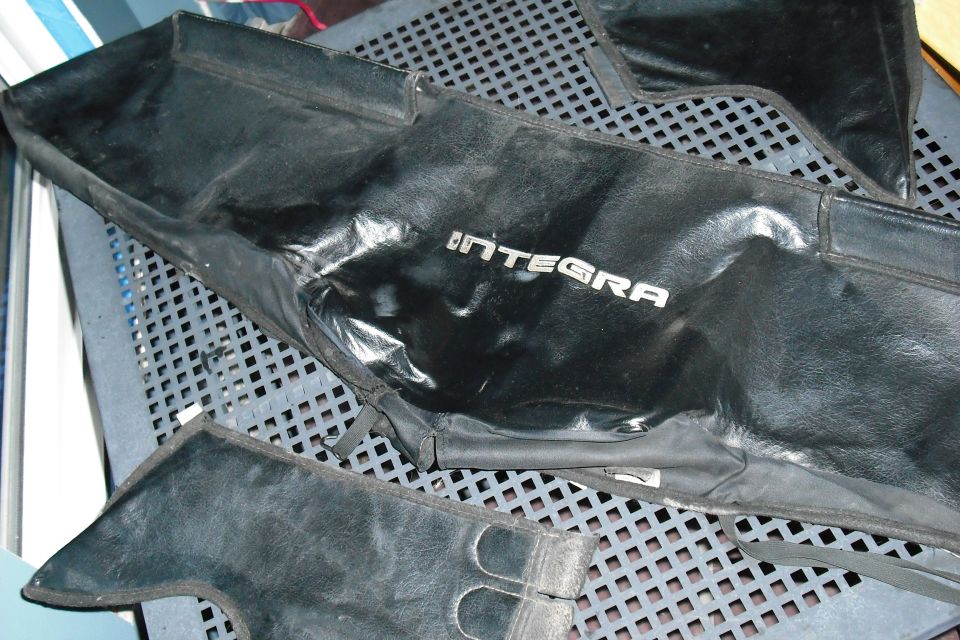 Black Integra car bra or cover on a metal table