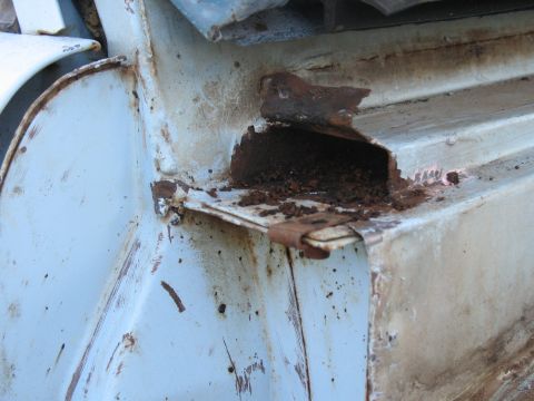 1976 Ford Bronco - This image shows significant rust and deterioration on a vehicle's metal components.