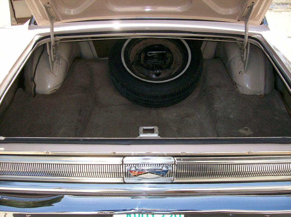 Trunk is clean with original liner & jack