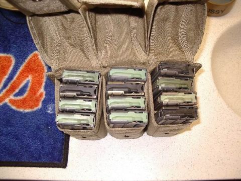 1985 Ford Bronco - A close-up view of a tactical pouch filled with magazines, with a towel in the background.
