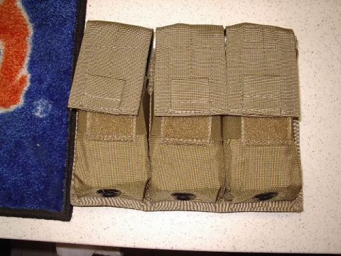 1985 Ford Bronco - A tan tactical pouch with three individual compartments is shown in a close-up view.