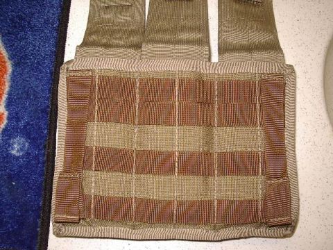 1985 Ford Bronco - Close-up of a tactical vest tan and brown MOLLE webbing for attaching gear.