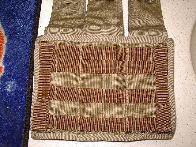 Tan and brown tactical vest with MOLLE webbing