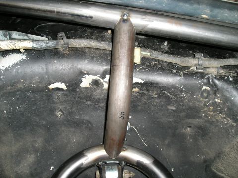 1986 Toyota Hilux - Close-up of custom roll cage tubing inside a vehicle, with a handwritten '45' marking visible on one of the tubes.
