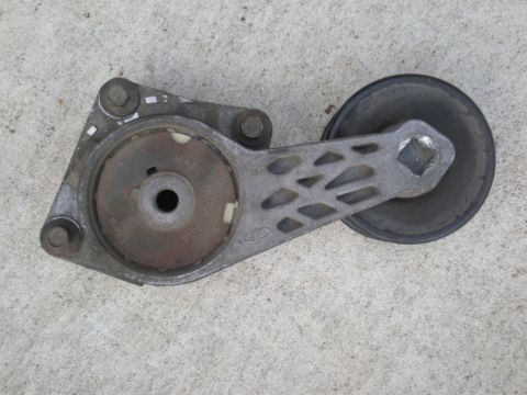 2007 Ford Mustang - This is a Ford belt tensioner pulley, showing "MADE IN CANADA" and the Ford logo.