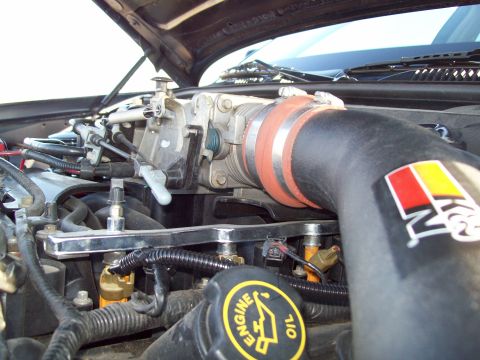 1999 Mercury Grand Marquis - Close-up view of an engine bay, showing the intake system and engine oil cap.