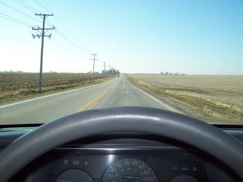 1999 Mercury Grand Marquis - Driving a 1999 Mercury Grand Marquis down a long, straight road through farmland.