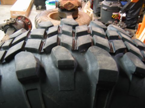 1992 Ford Mustang - Close-up view of a heavy-duty tire tread with deep, blocky lugs.