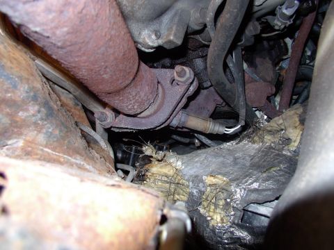 1990 Lincoln Town Car - To get the old manifolds off step one is to "easily" remove the brass nuts I so cleverly installed on the new headpipe studs two years ago.