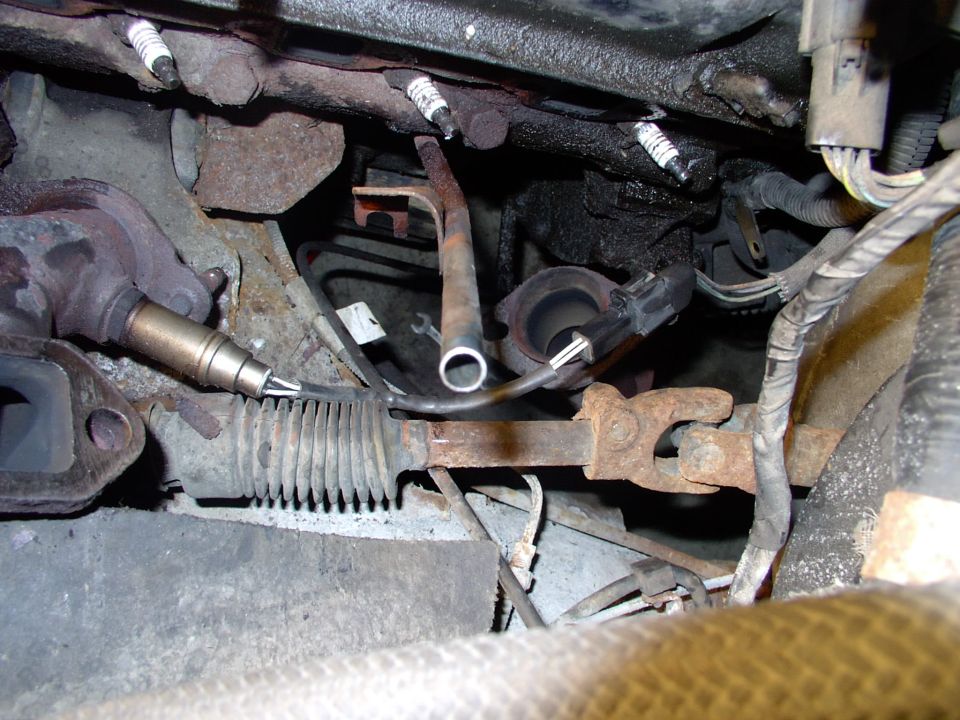 By pulling the now loose manifold forward I was able to disconnect the O2 sensor very easily.
