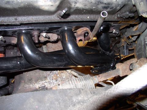 1990 Lincoln Town Car - A trial fit of these Mustang shorties was the next step. Two bolts was enough to hold it in place.
