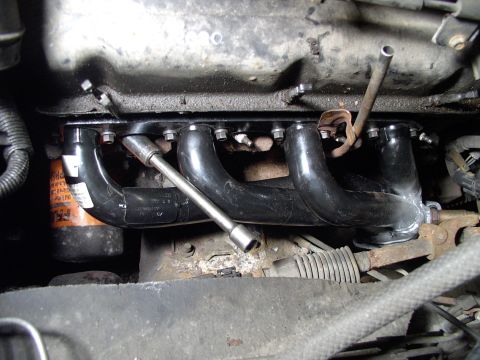 1990 Lincoln Town Car - Headers bolted in and the oil dipstick tube tab judiciously bent until it fit properly.