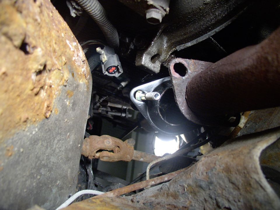How did I get the Y-pipe to bolt up ? It was @ 1 1/8" too narrow, meaning I had to widen the headpipes away from each other. I just jammed an old shovel handle down one and bent it gently 3 times until it BOLTED RIGHT UP to the supposedly Mustang only headers